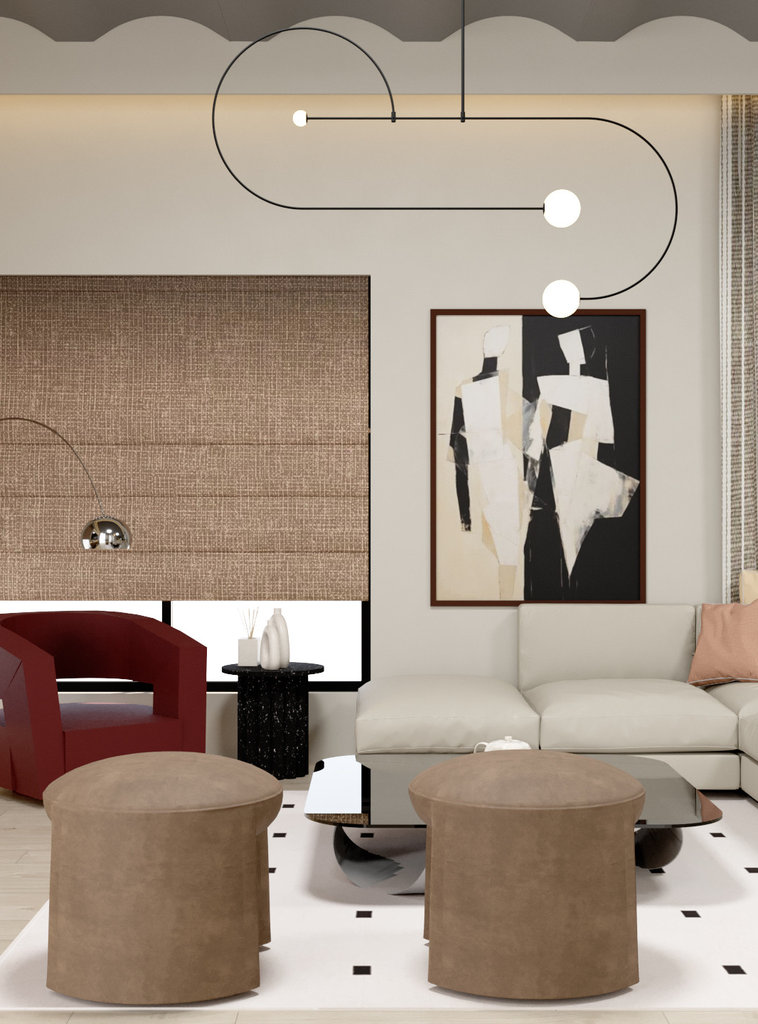 Living room with a sculptural looping pendant, cream sectional and burgundy armchair against a woven blind