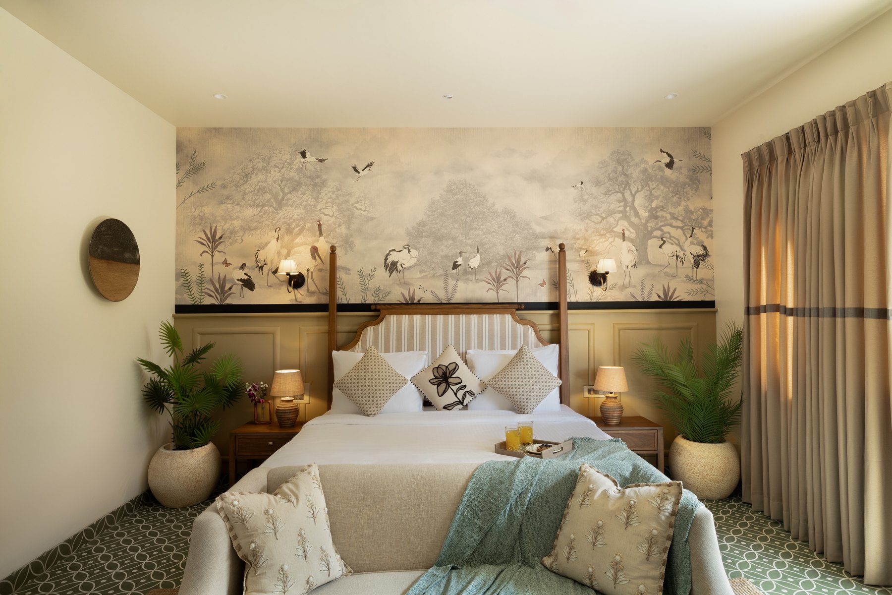 Bedroom with a crane mural, striped headboard and green patterned floor