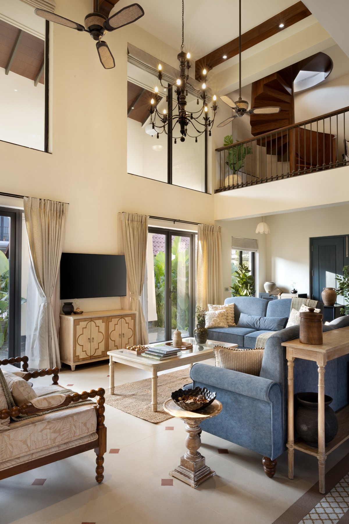 Living room towards the television cabinet, chandelier overhead and garden doors alongside